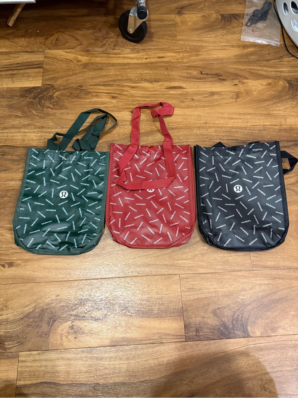lululemon athletica Red, Green & Black Patterned Shopping bags